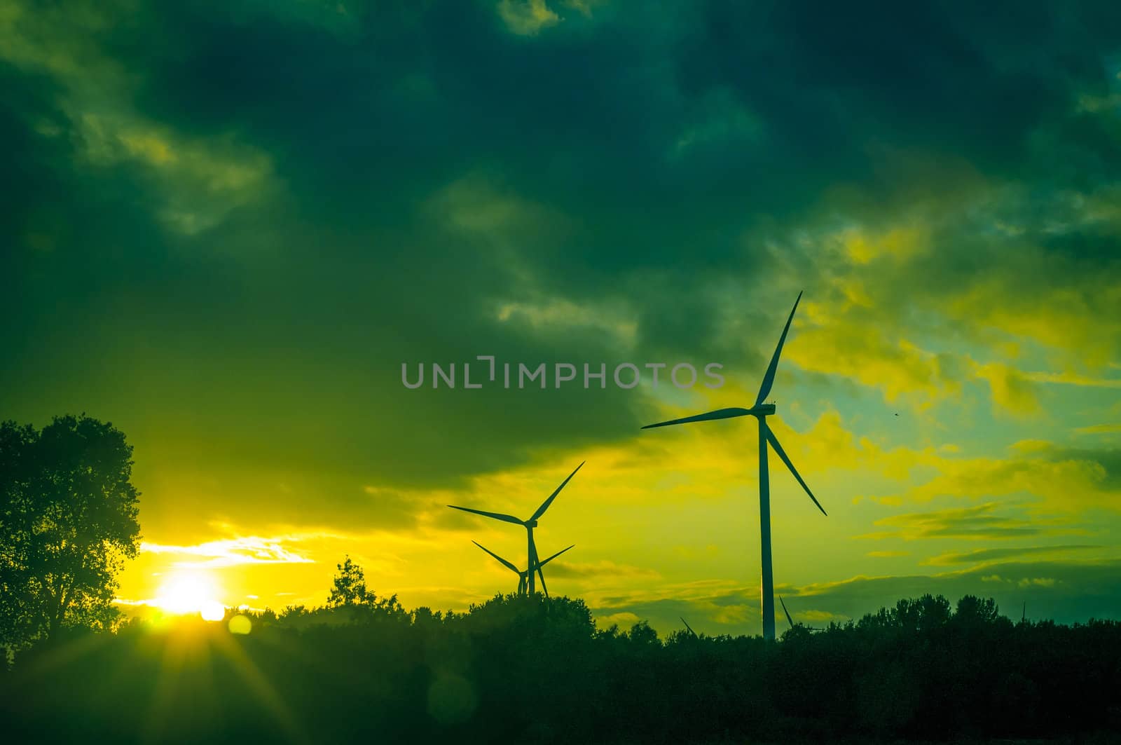 An image of windturbine during beautiful sunset