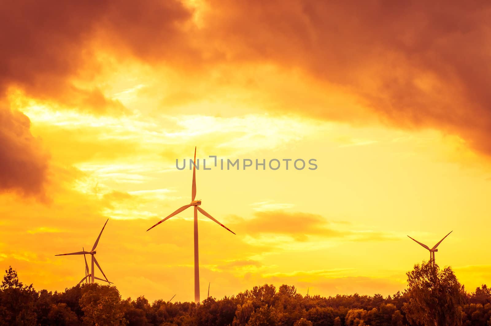 An image of windturbine during beautiful sunset