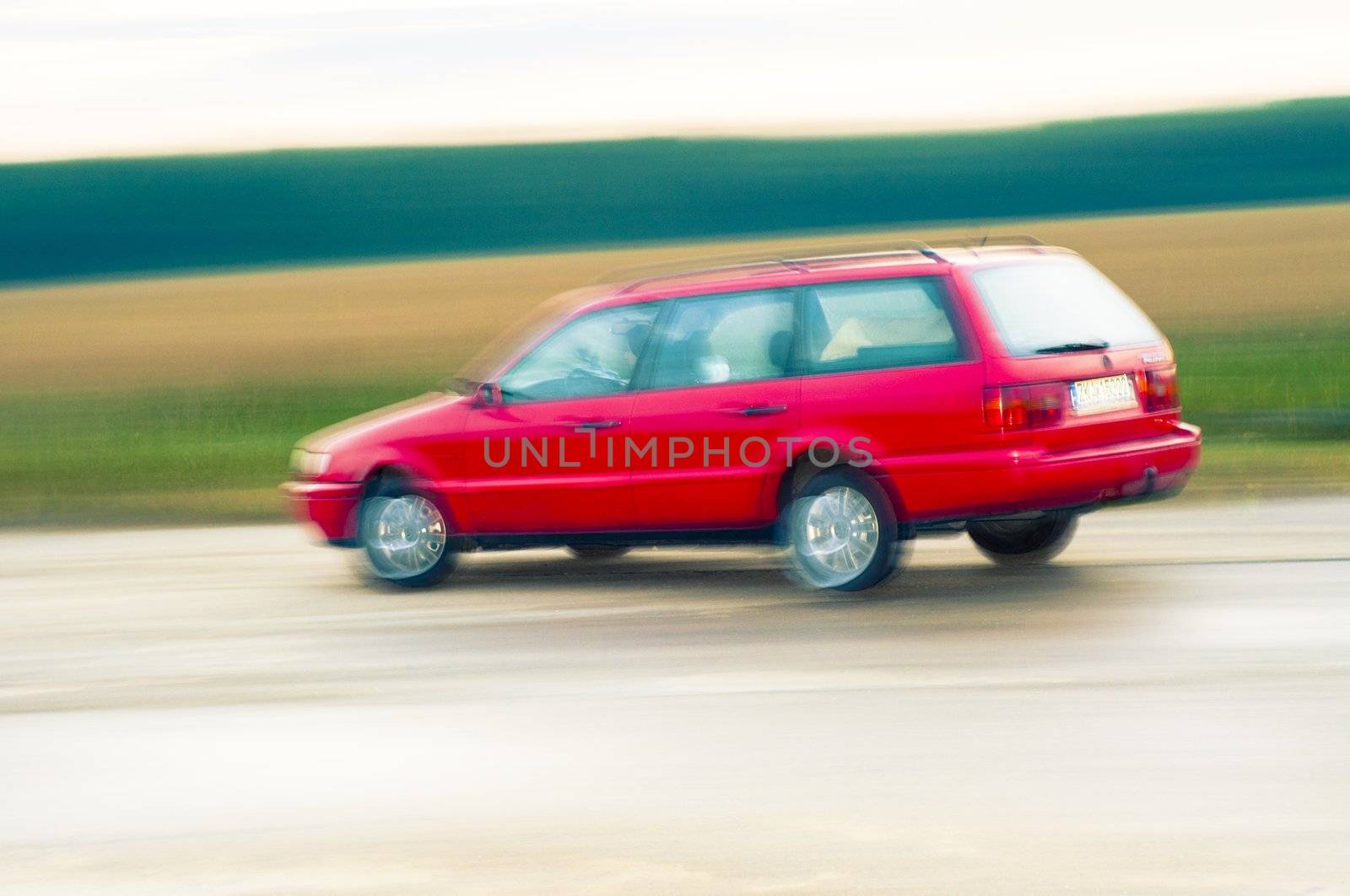 An abstract image of drunk driver driving red car
