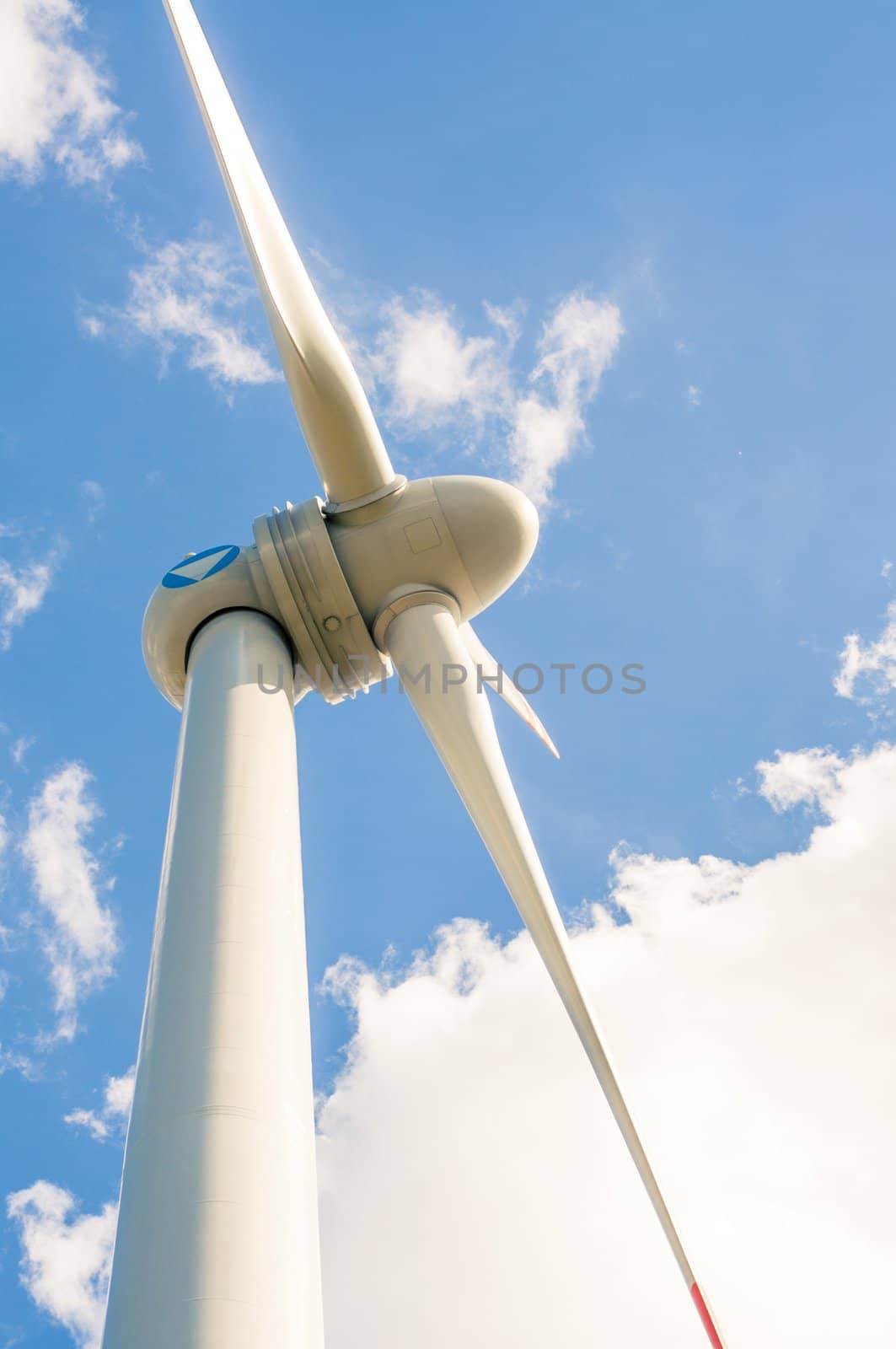 An image of windturbines against blue sky