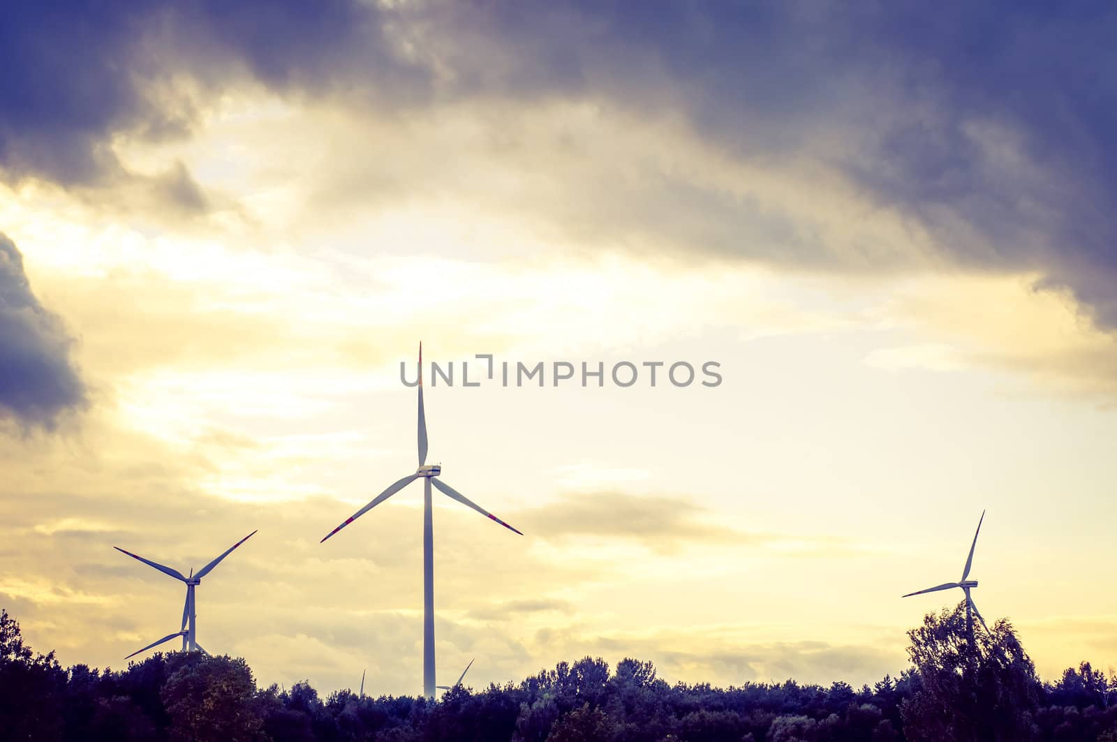 An image of windturbine during beautiful sunset