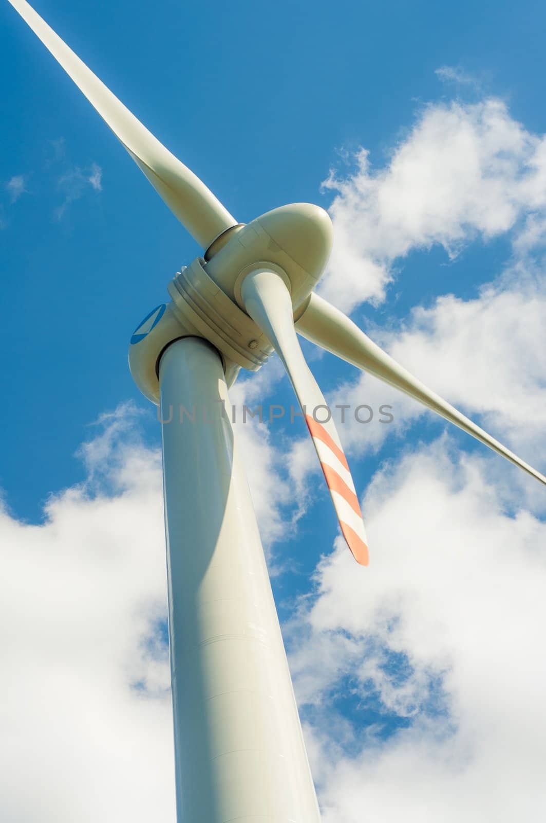 An image of windturbines against blue sky
