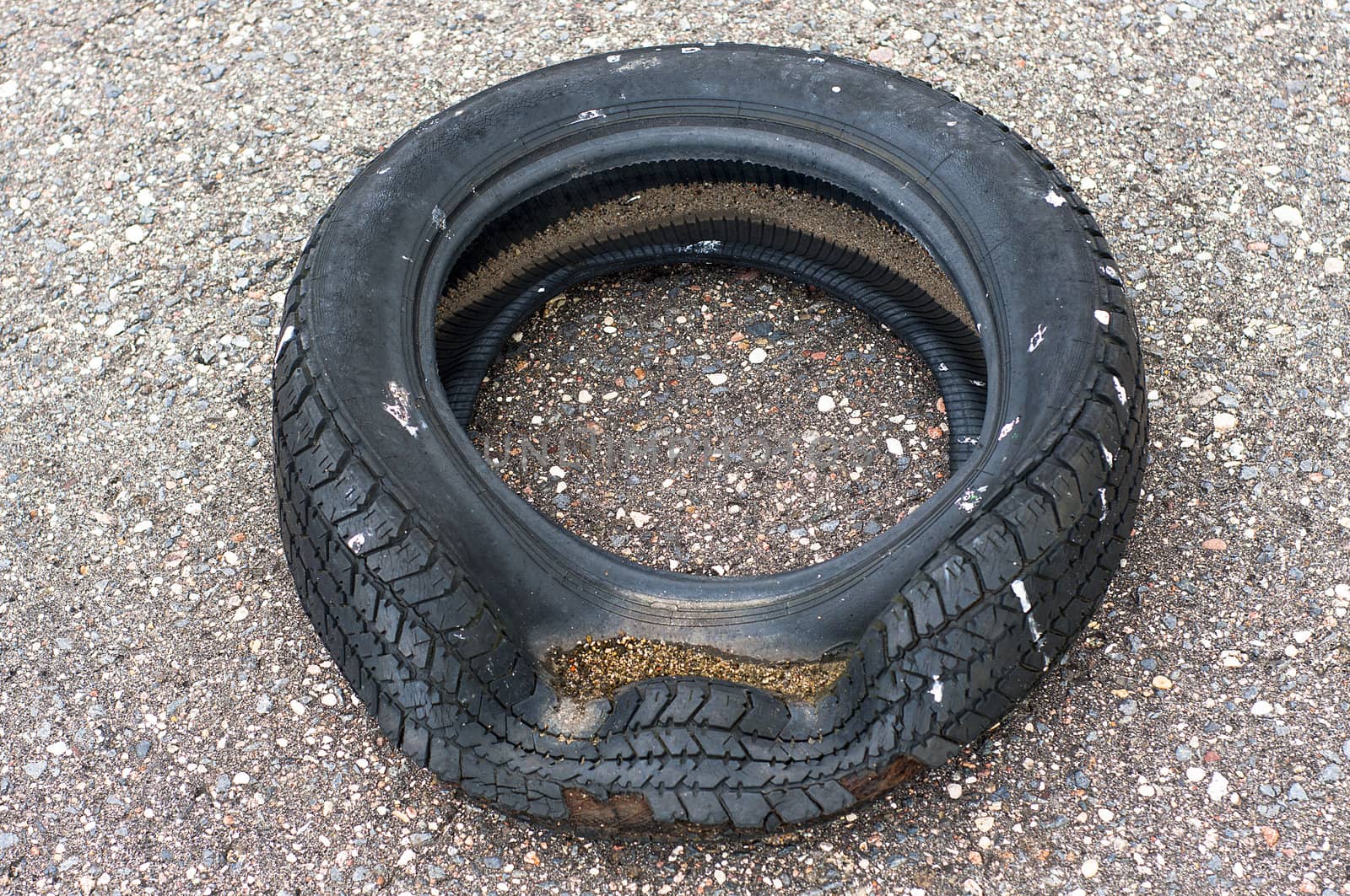 Wrecked old tire on the street