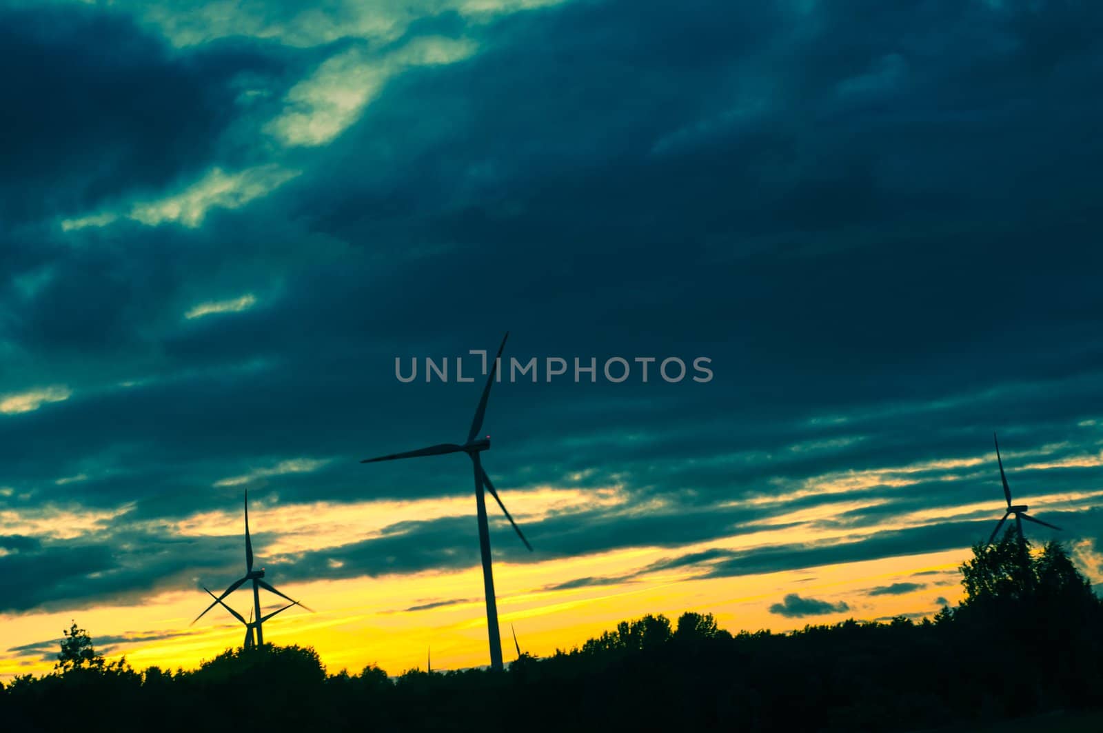 An image of windturbine during beautiful sunset