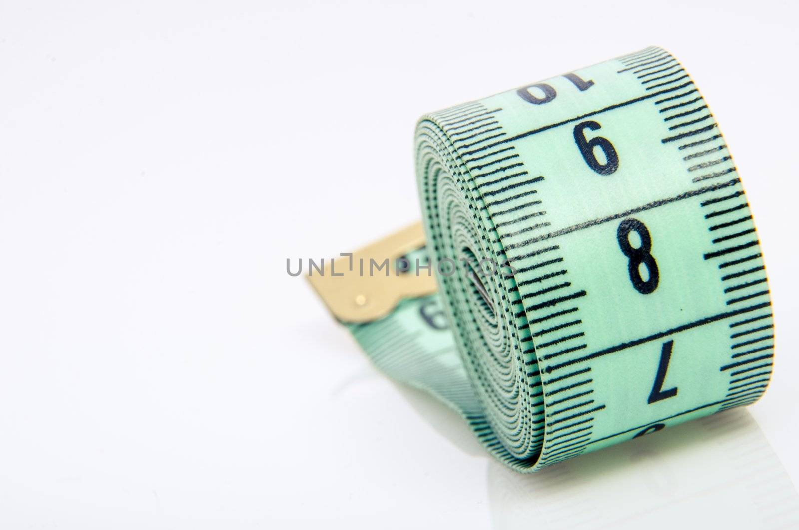 An image of green centimeter on white background