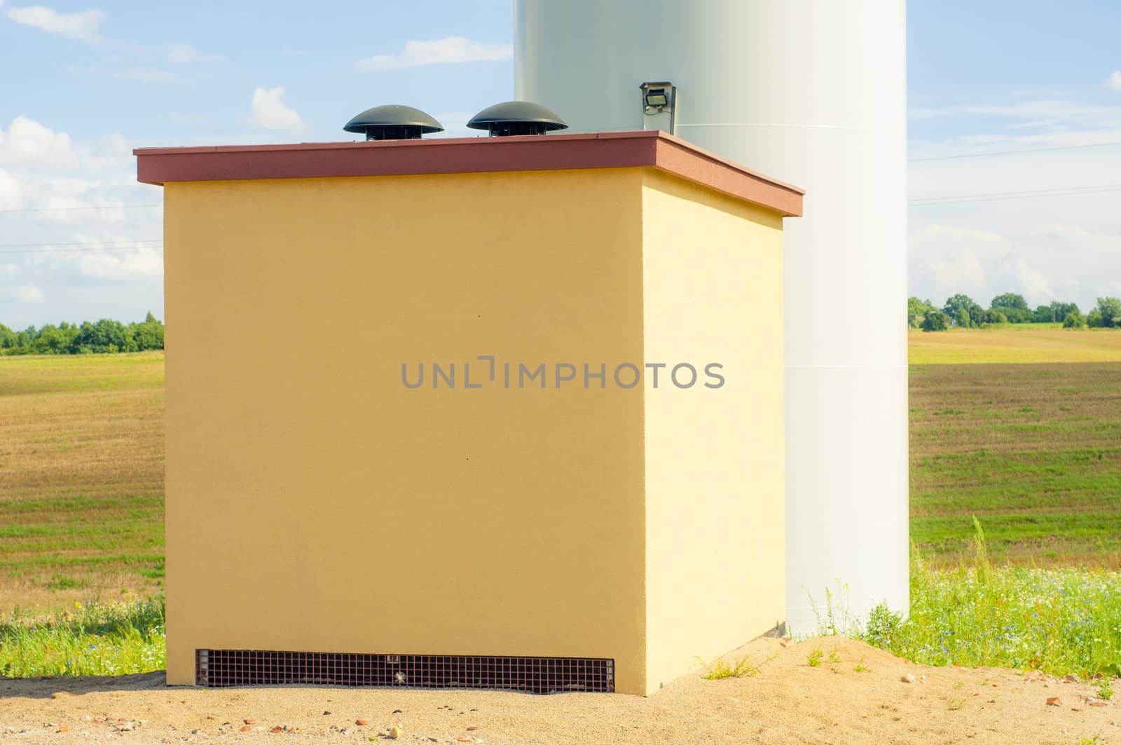 An image of windturbines against blue sky