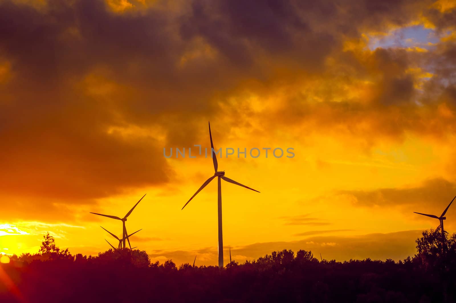 An image of windturbine during beautiful sunset
