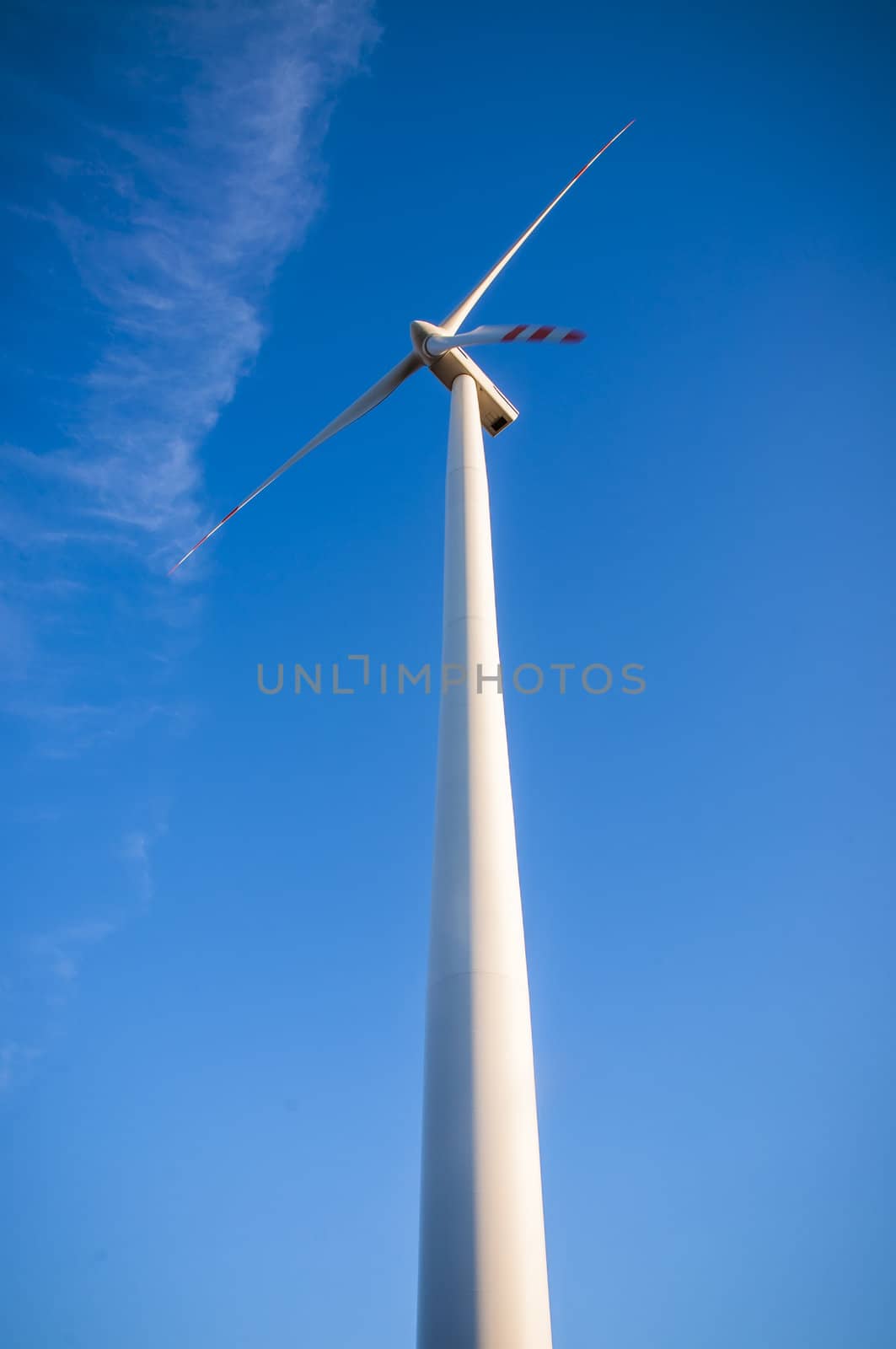 An image of windturbines at dusk
