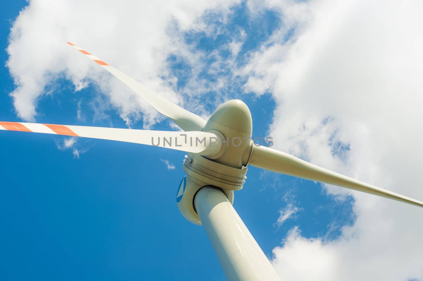 An image of windturbines against blue sky