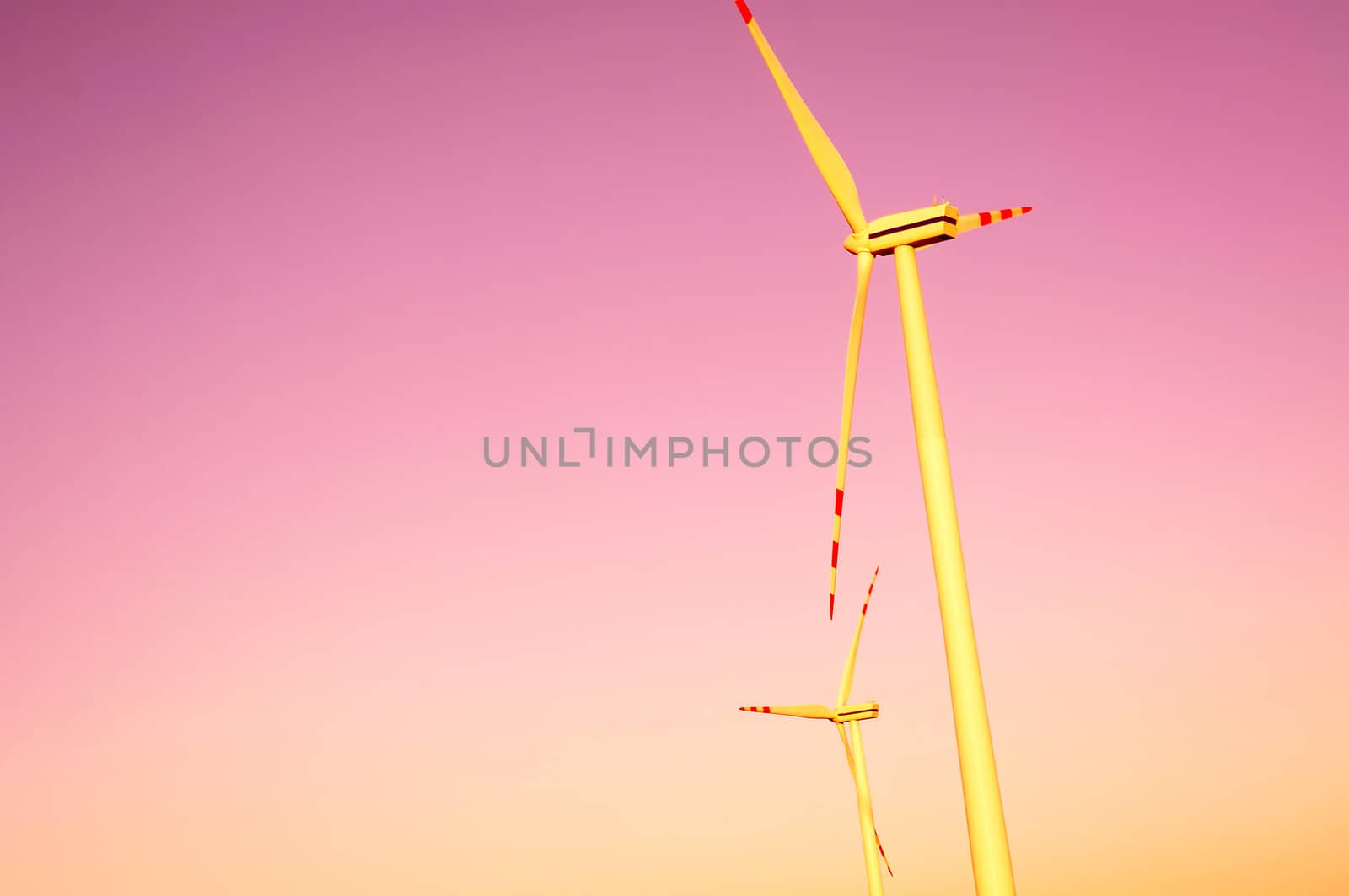 An image of windturbines at dusk