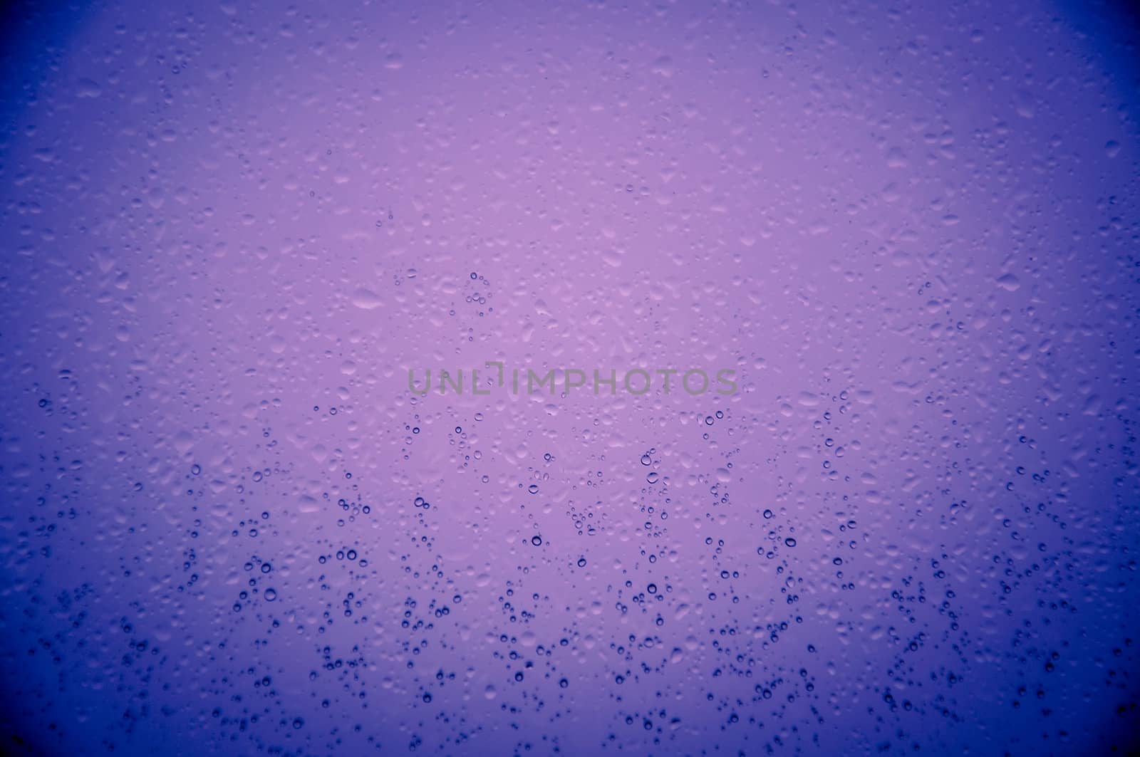 An image of waterdrops on the window