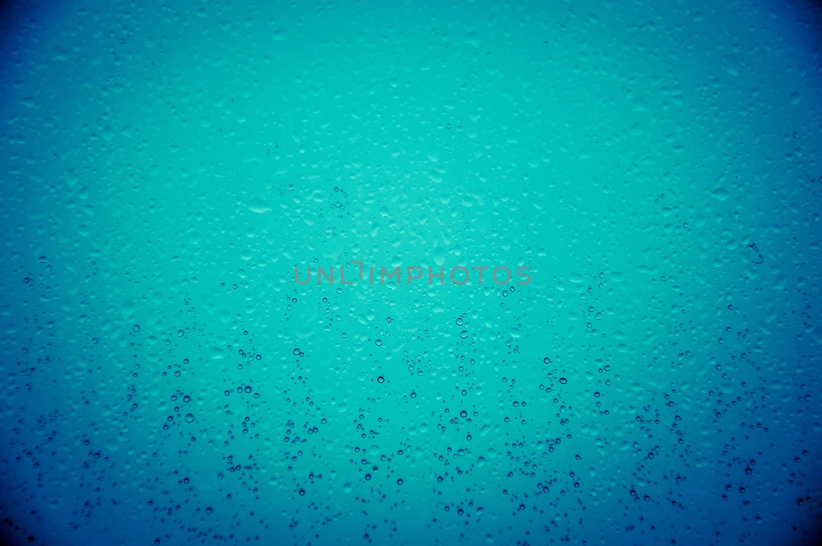An image of waterdrops on the window