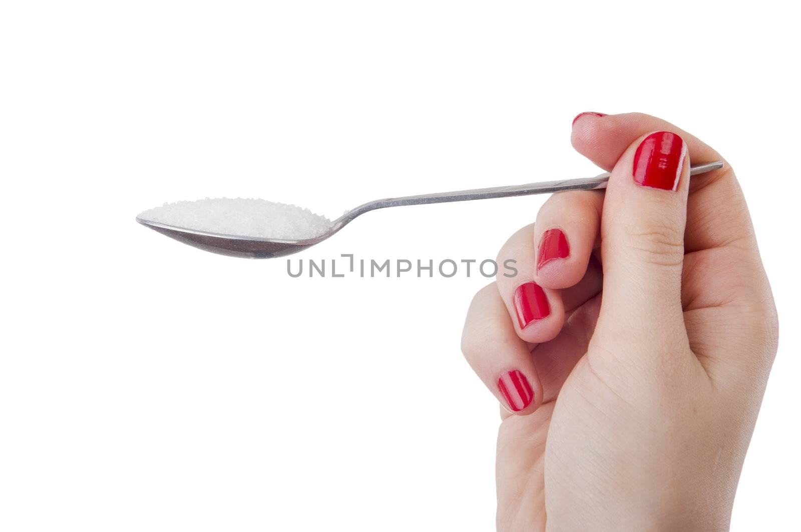 An image of woman holding spoon full of sugar