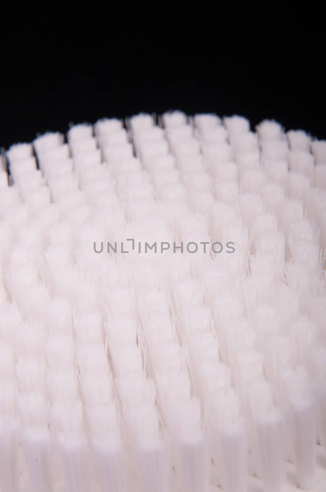 an image of white brush isolated on black