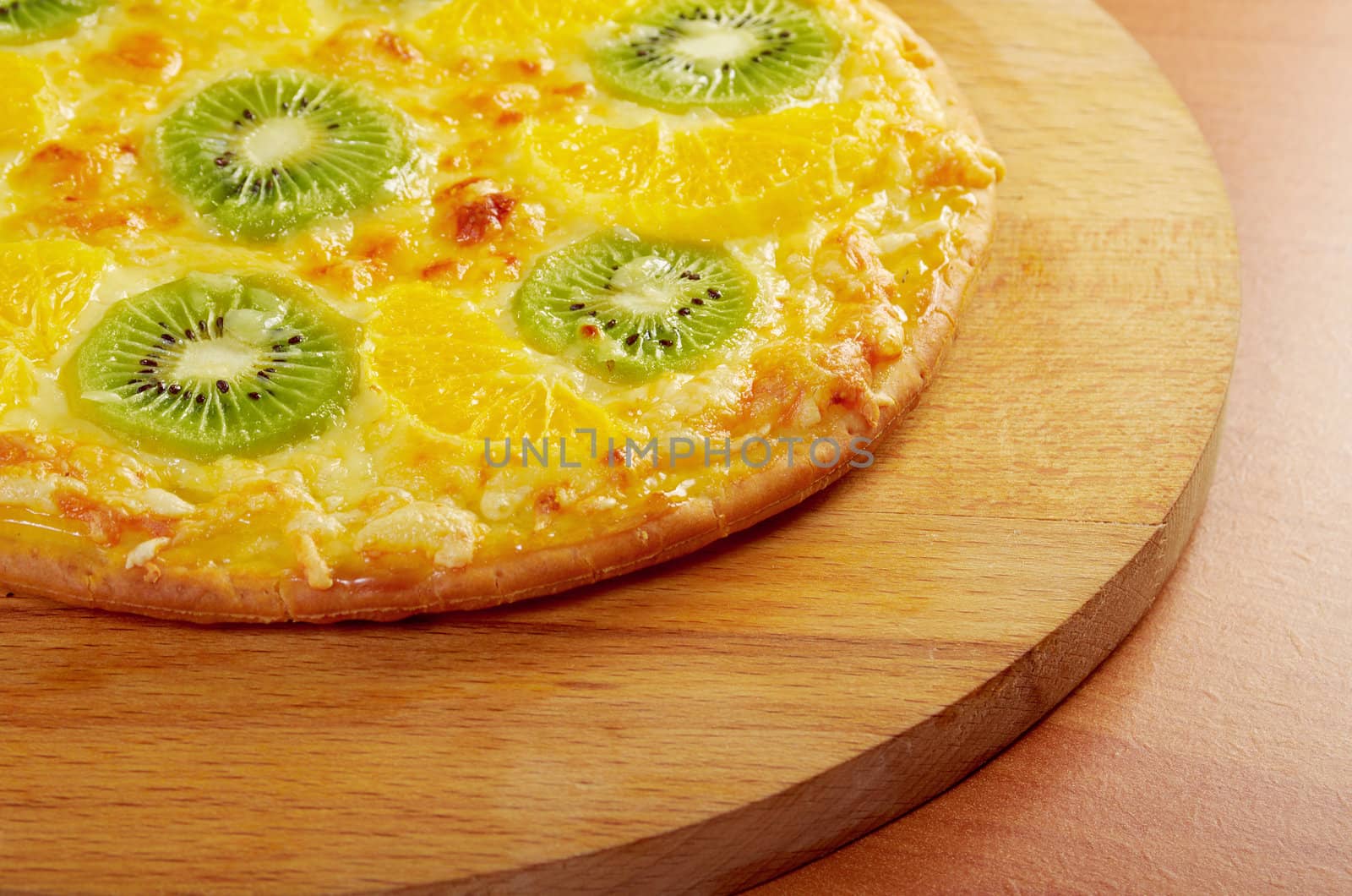 homemade sweet pizza with fruit.with orang kiwi,sauce