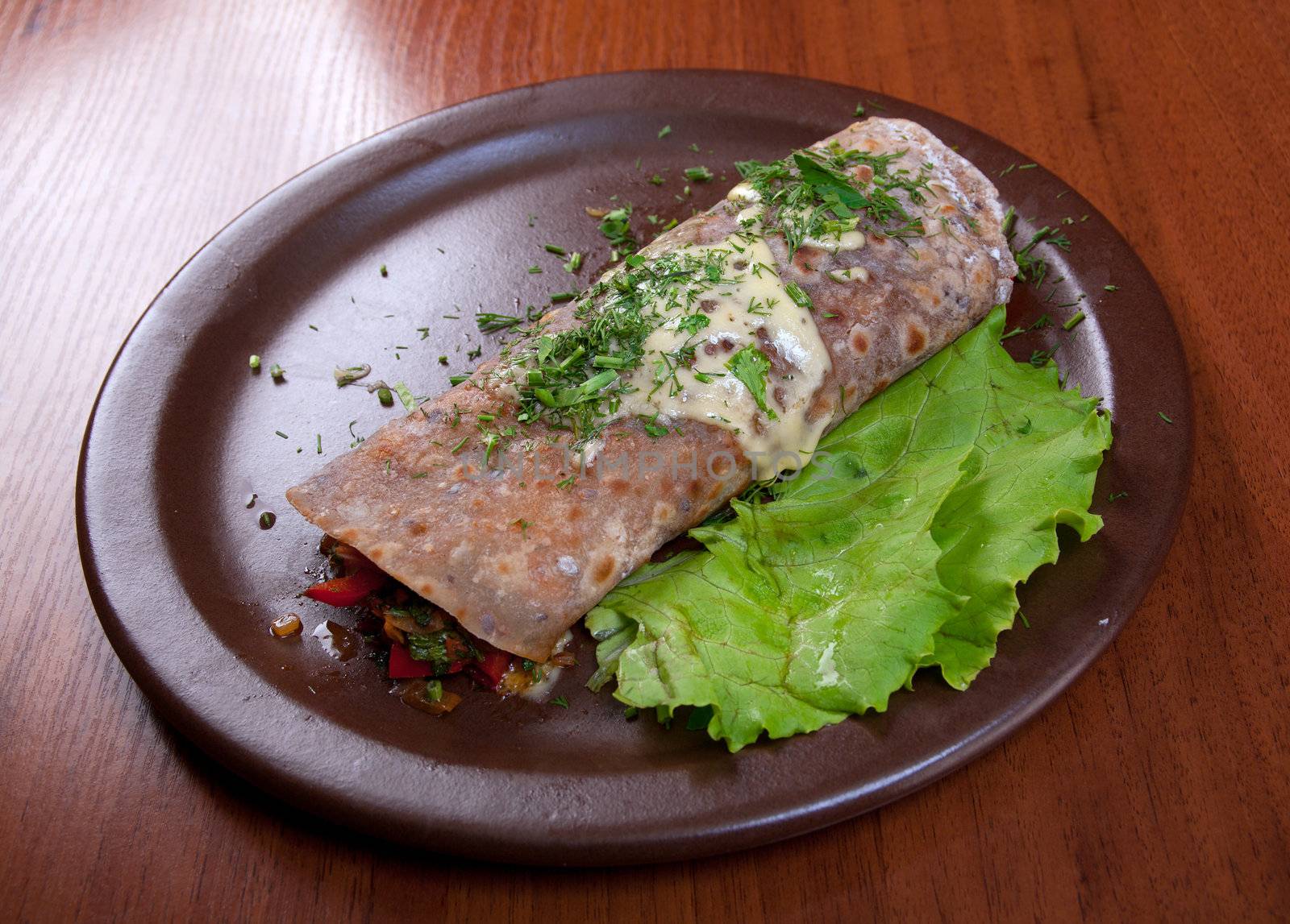 rolled pancakes stuffed with vegetables. Shallow depth-of-field.