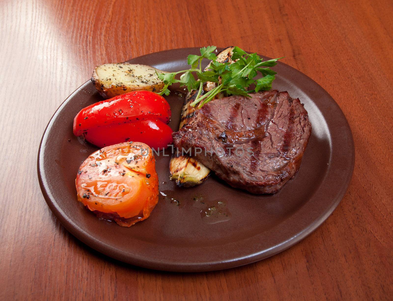 Grilled beef on white plate  with vegetable