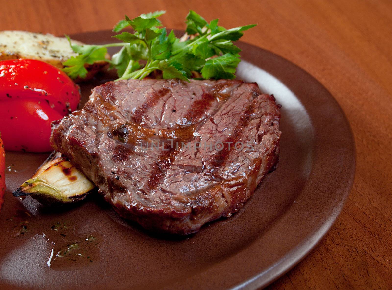 Grilled beef on white plate  with vegetable