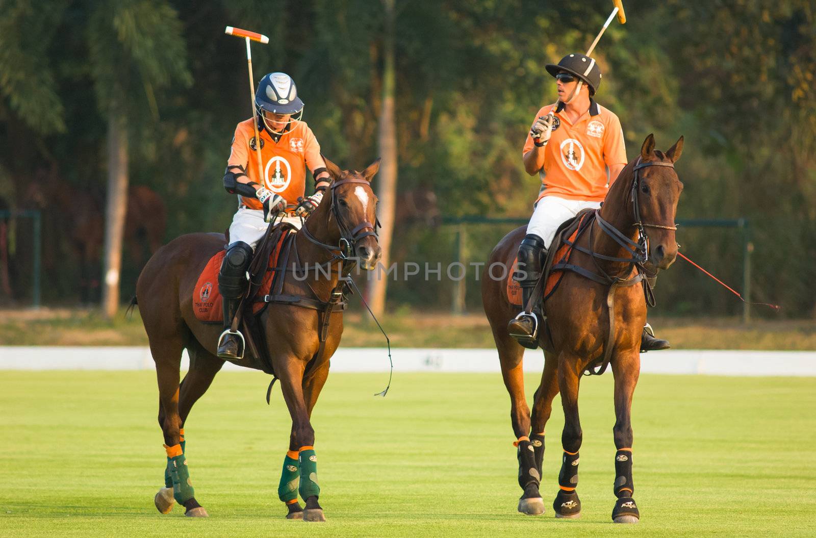 PATTAYA - JANUARY 19: Two players from Thai Polo during the final at Thai Polo Open 2013 on January 19, 2013 in Pattaya, Thailand.