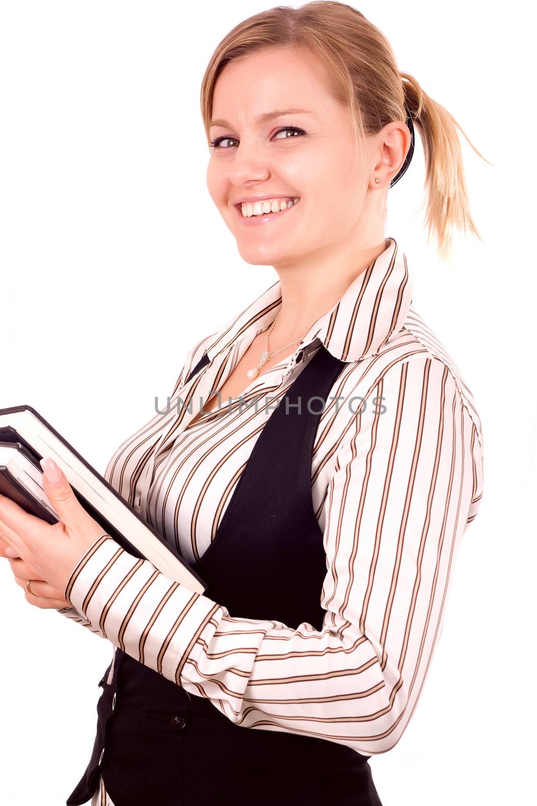 Happy teenage girl with a notebook and pencil on a white background
