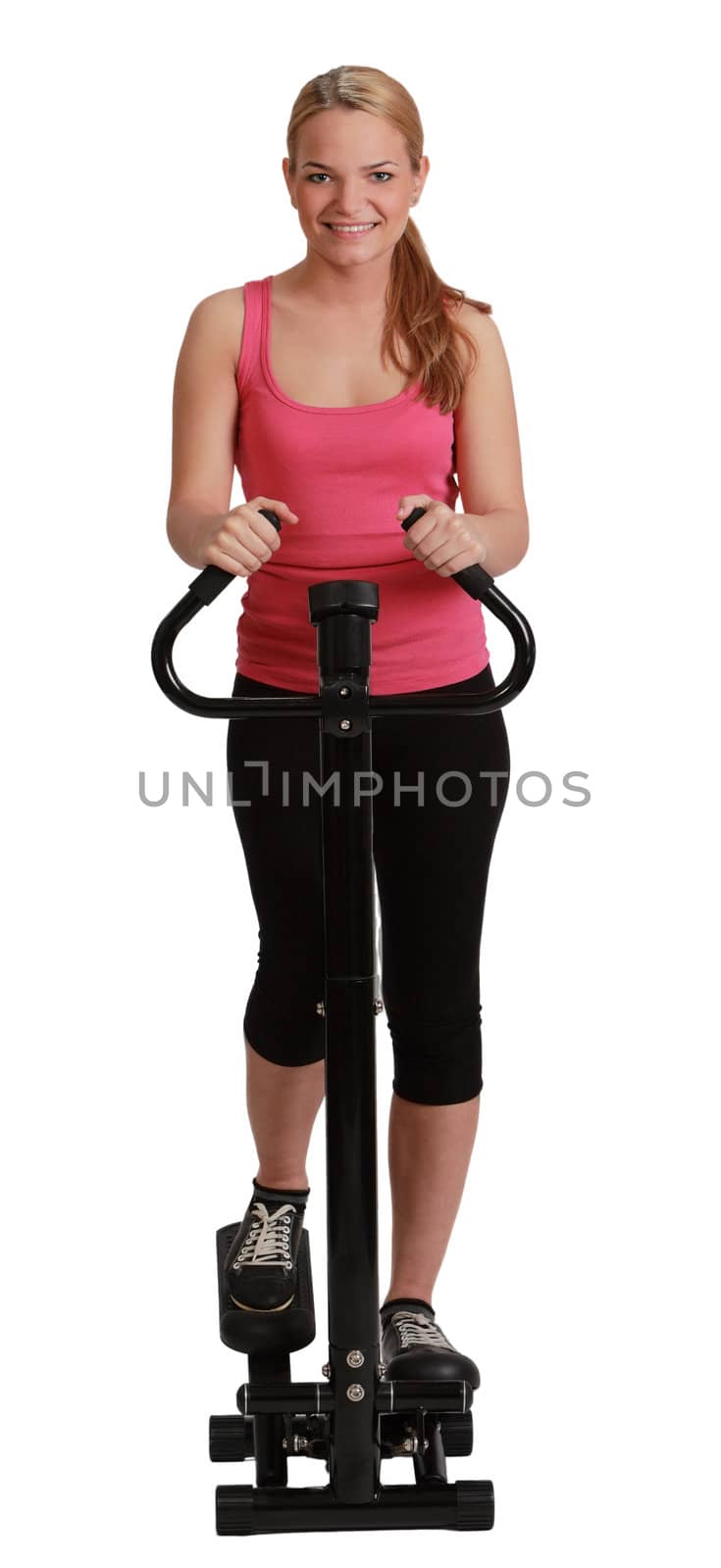 Young smiling blonde woman exercising on a stepperagainst a white background.