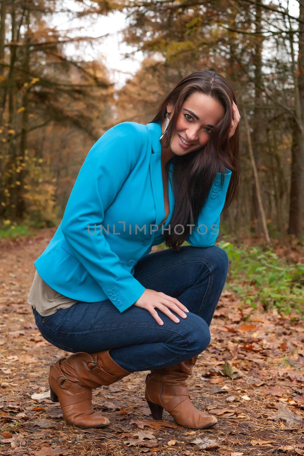 Beauty young woman in the forest is having a nice time