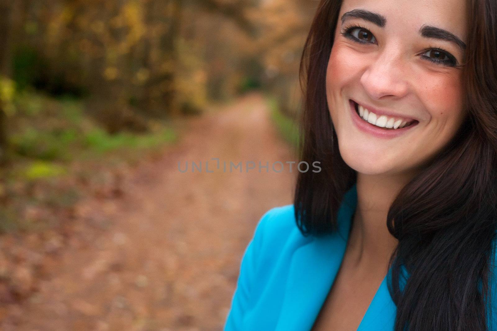 Beauty young woman in the forest is having a nice time