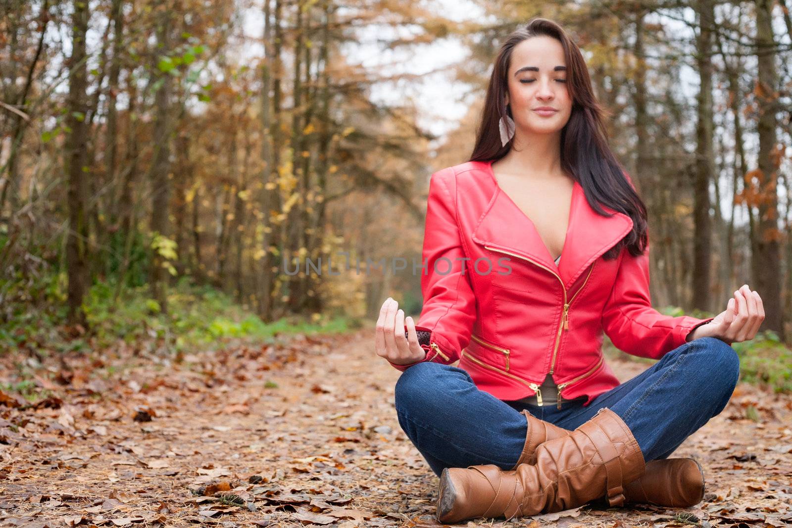 Beauty young woman in the forest is having a nice time