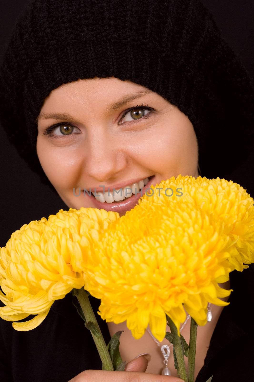 Romantic image of a young woman with yellow chrysanthemums
