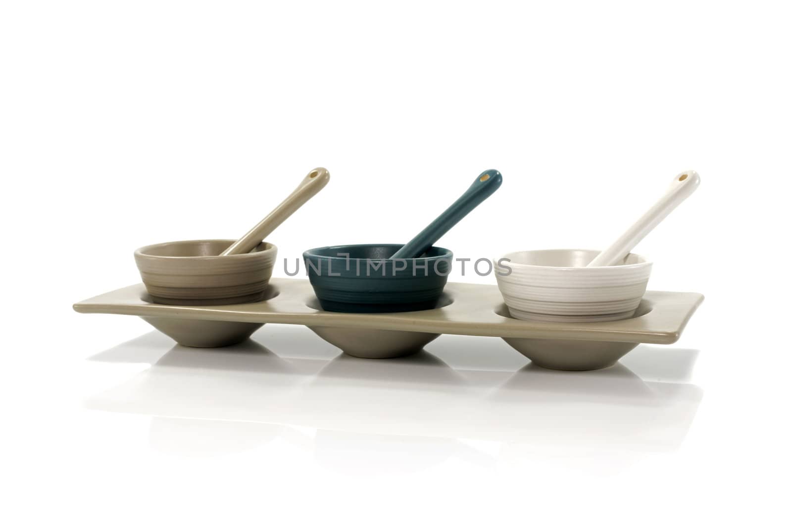 three porcelain cups isolated on white