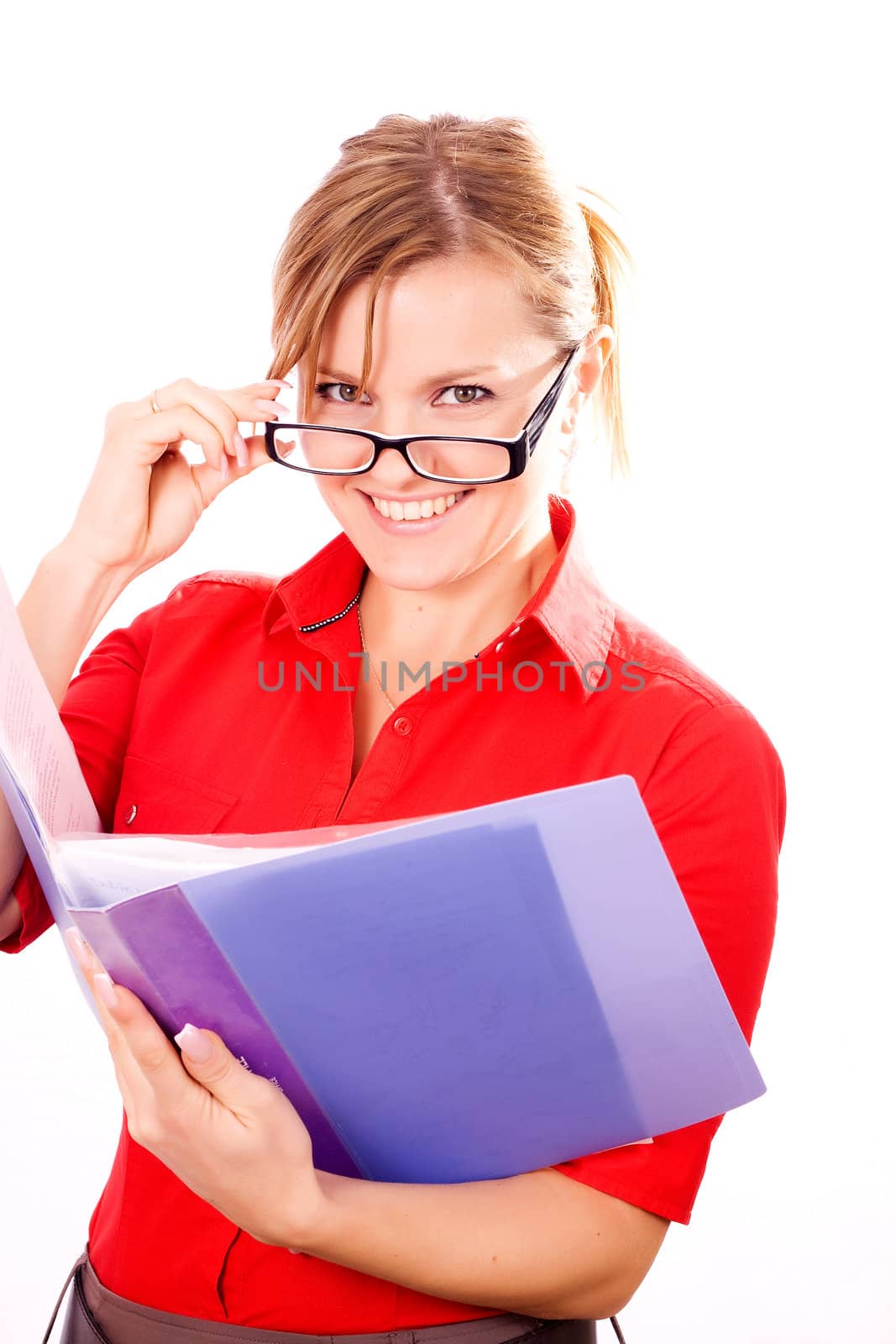 Portrait of a beautiful young business woman holding a folder, considering options
