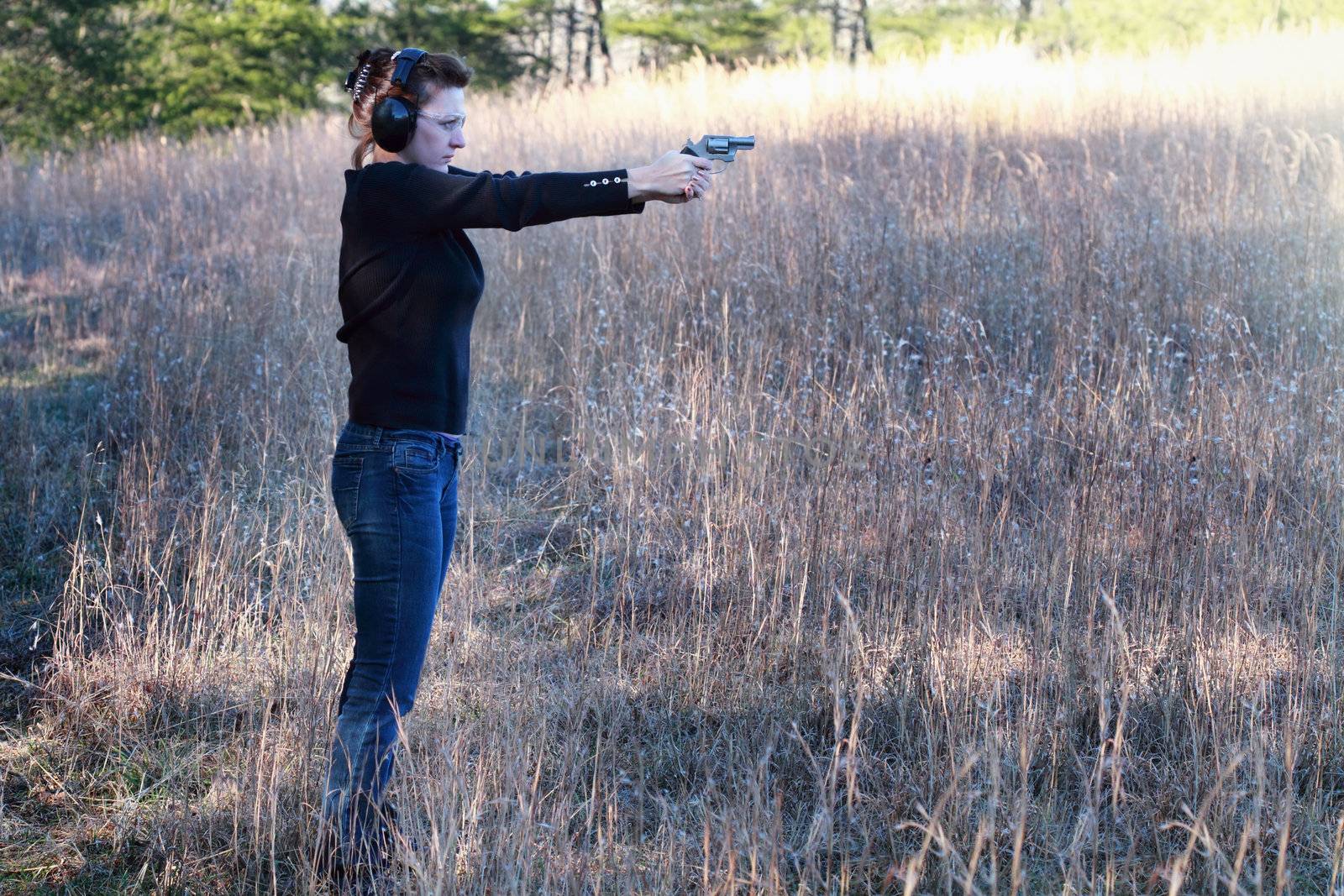 Woman Shooting a Firearm by StephanieFrey