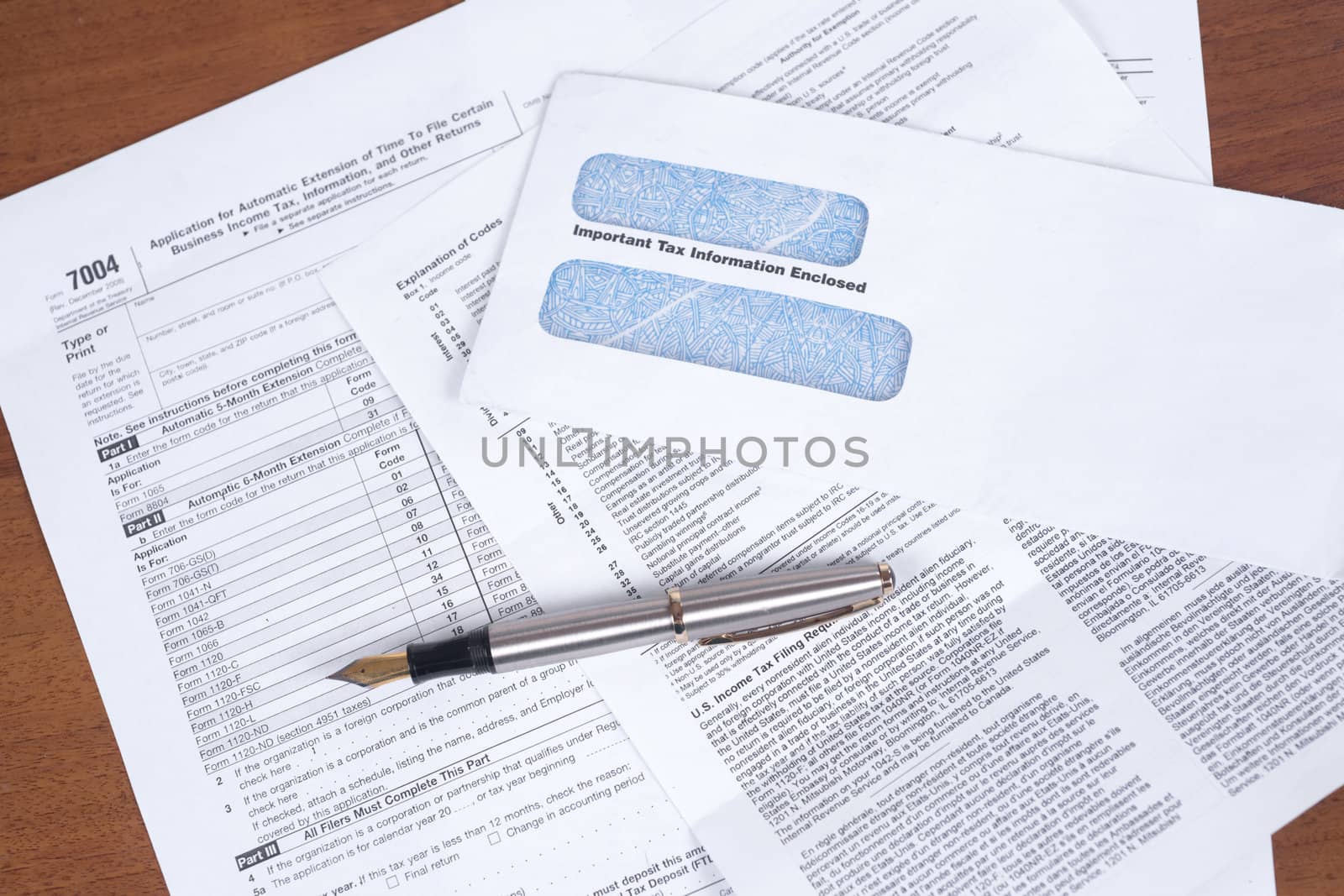 Pen and the letterheads lay on a table