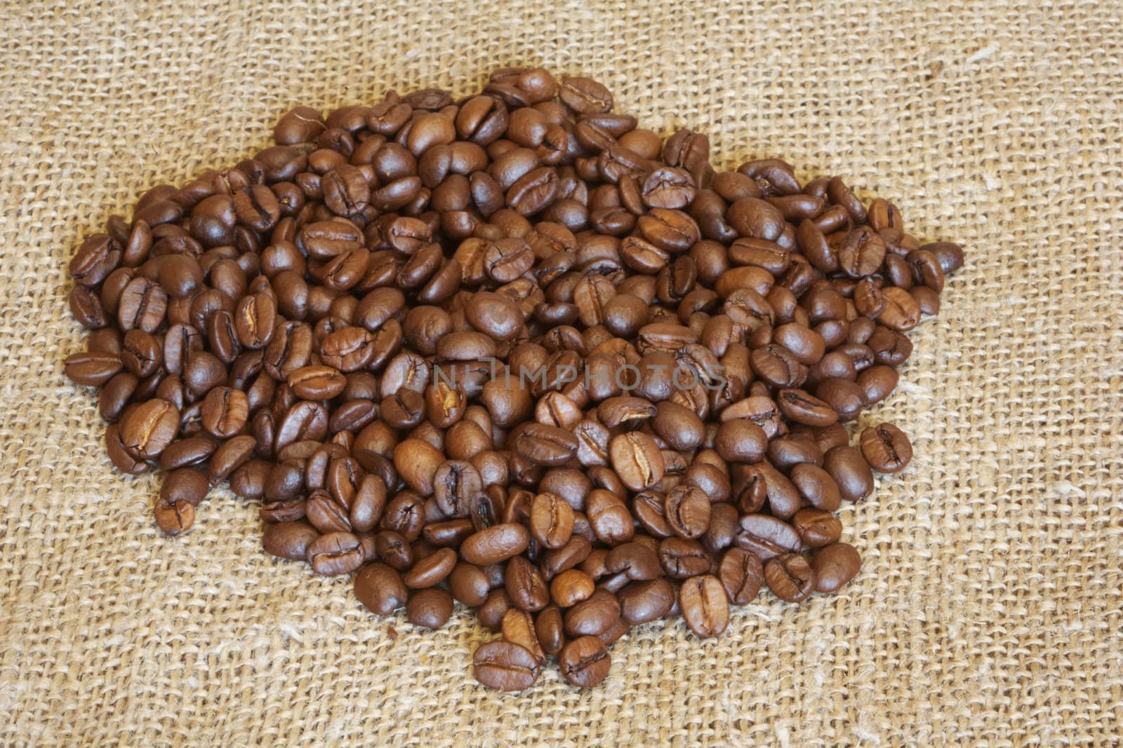 It is a lot of coffee grains lay on a fabric