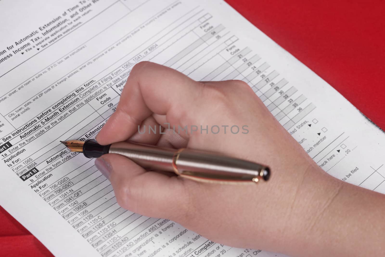 Hand and document on a red background