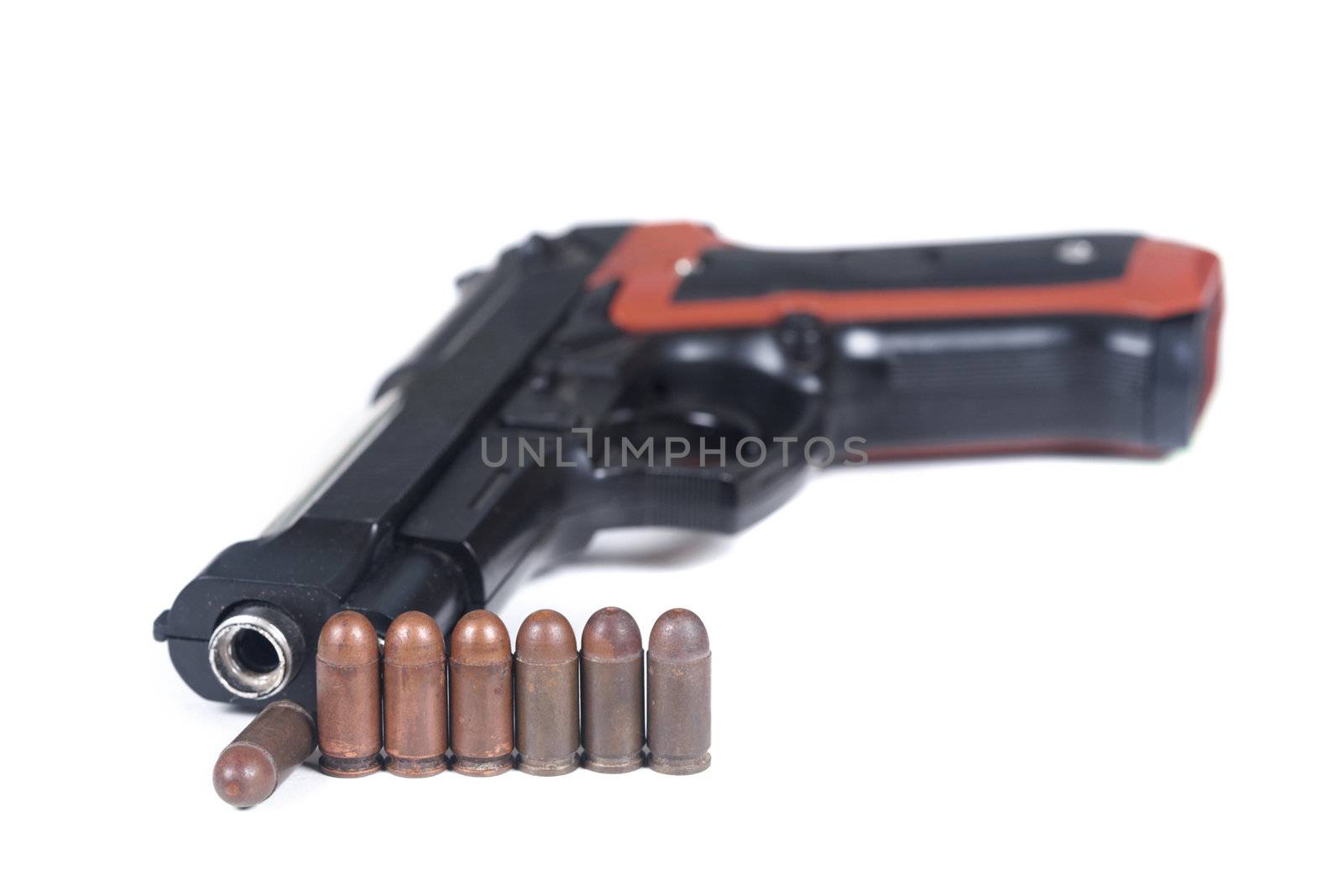 Pistol and ammunition on a white background