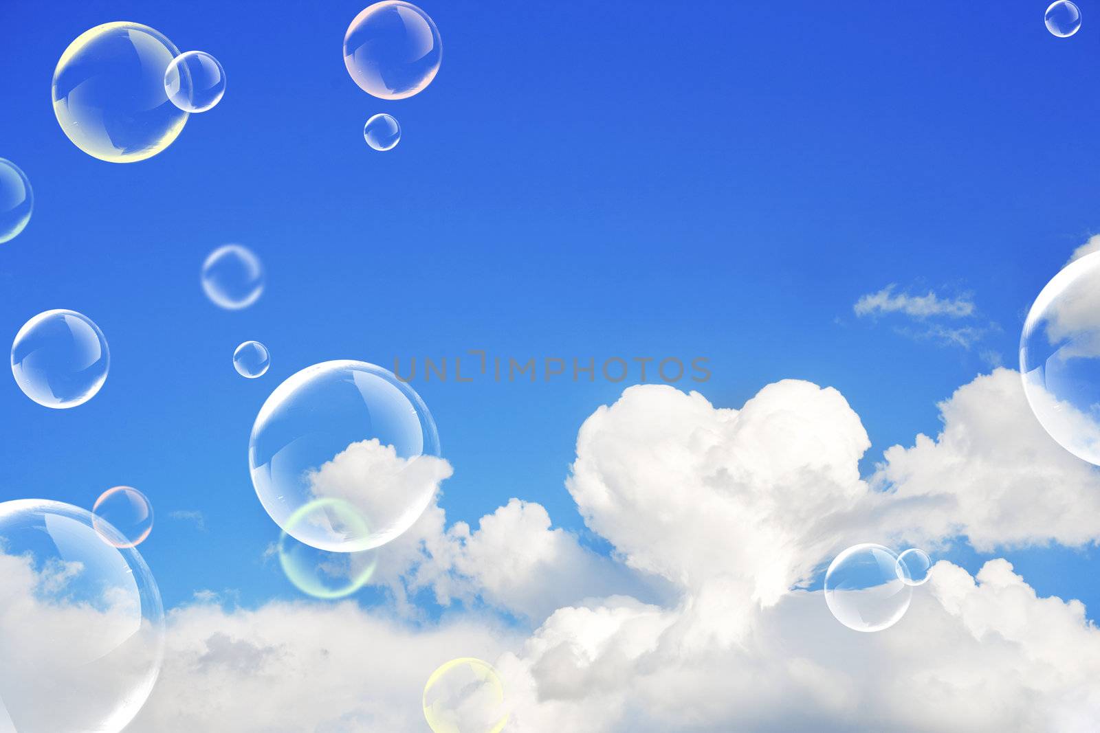 The soap bubbles. White cloud in the light-blue sky