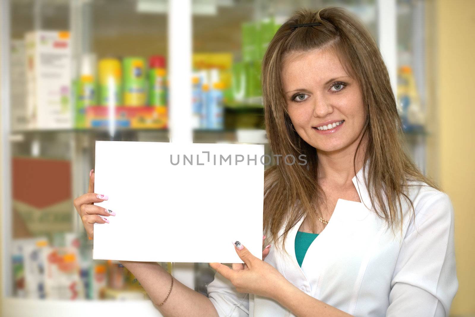 Medicine. Chemist woman standing in pharmacy drugstore. Paper