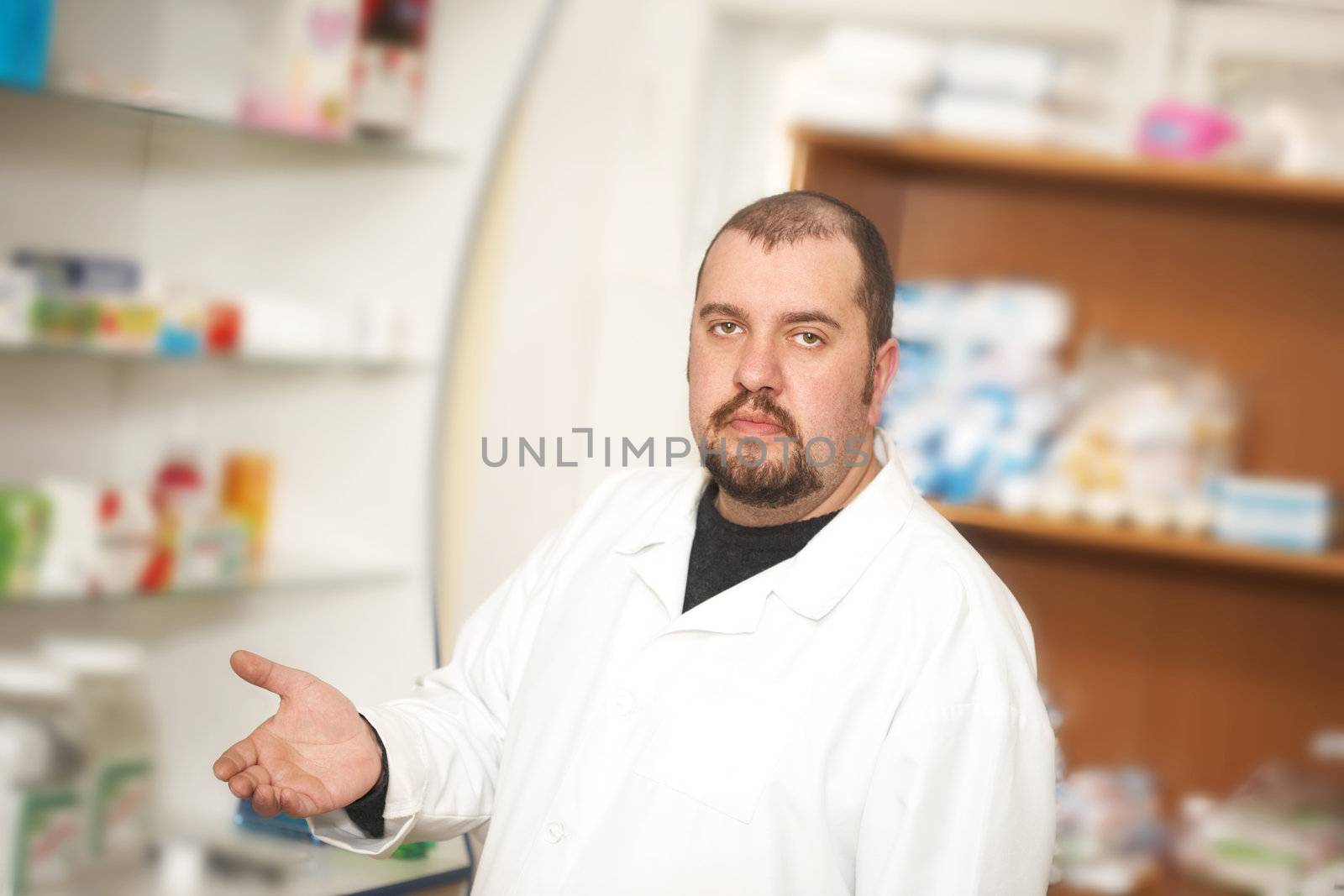 Portrait of a male pharmacist at pharmacy. Medicine 