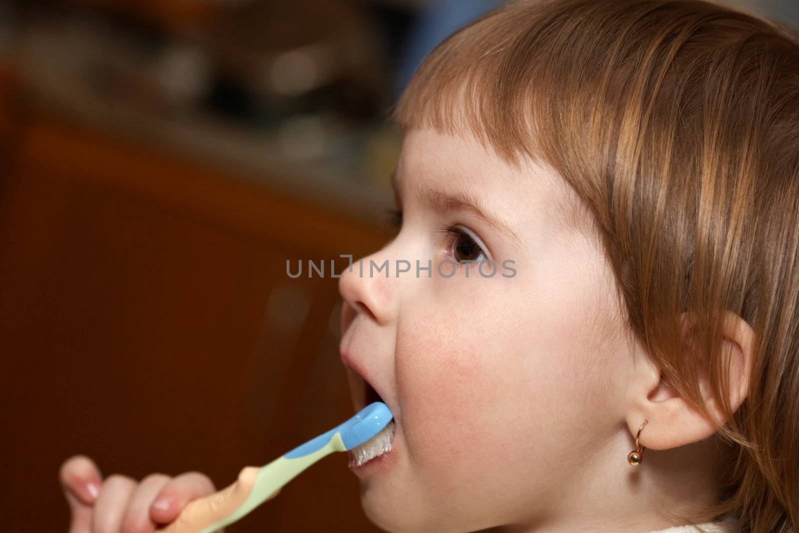 Hygiene. The child cleans teeth by petrkurgan