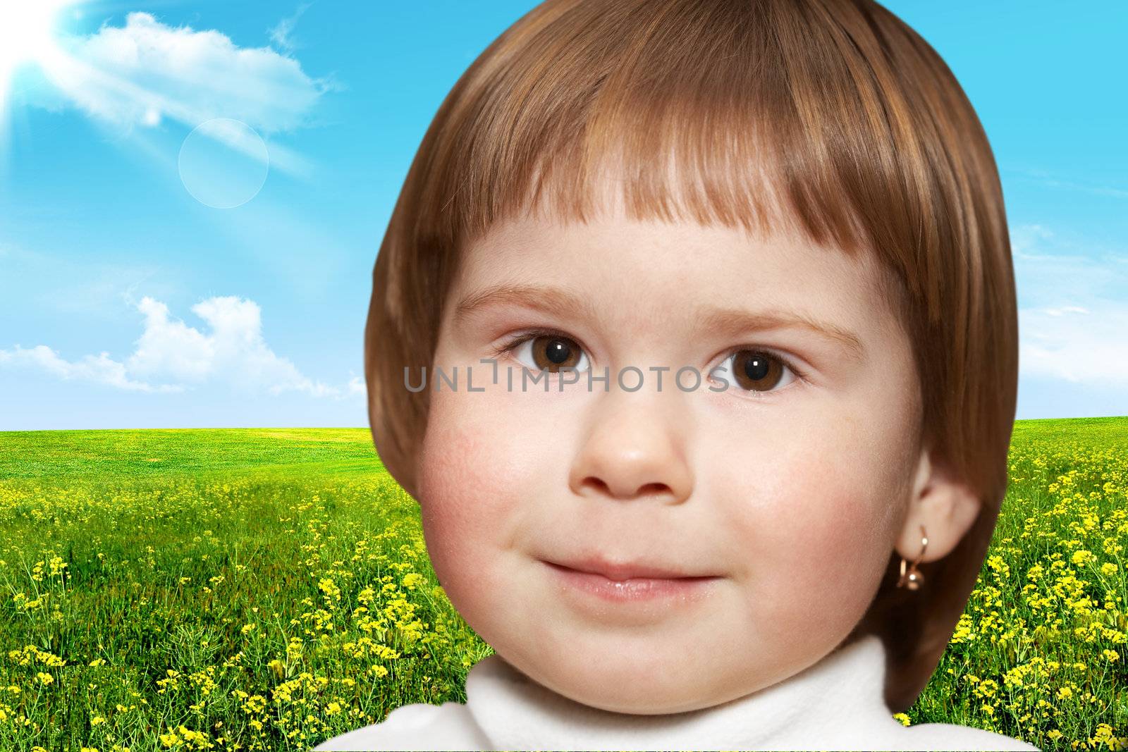 Portrait of the small girl. The sky and field