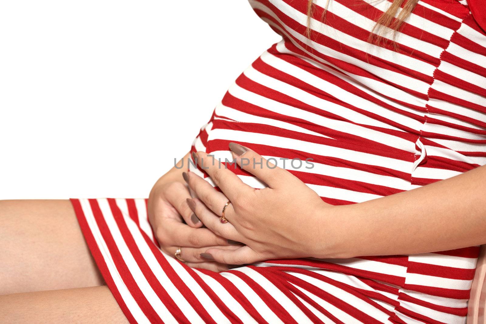 Image of pregnant woman touching her belly with hands