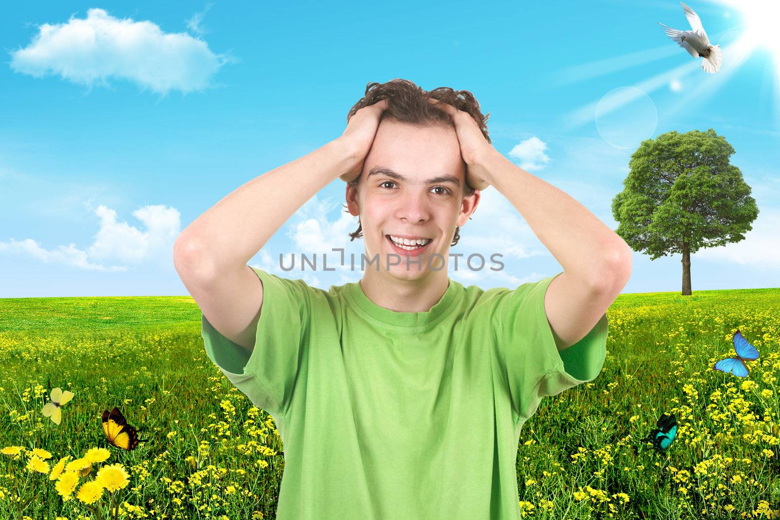The joyful teenager on a green background. Summer