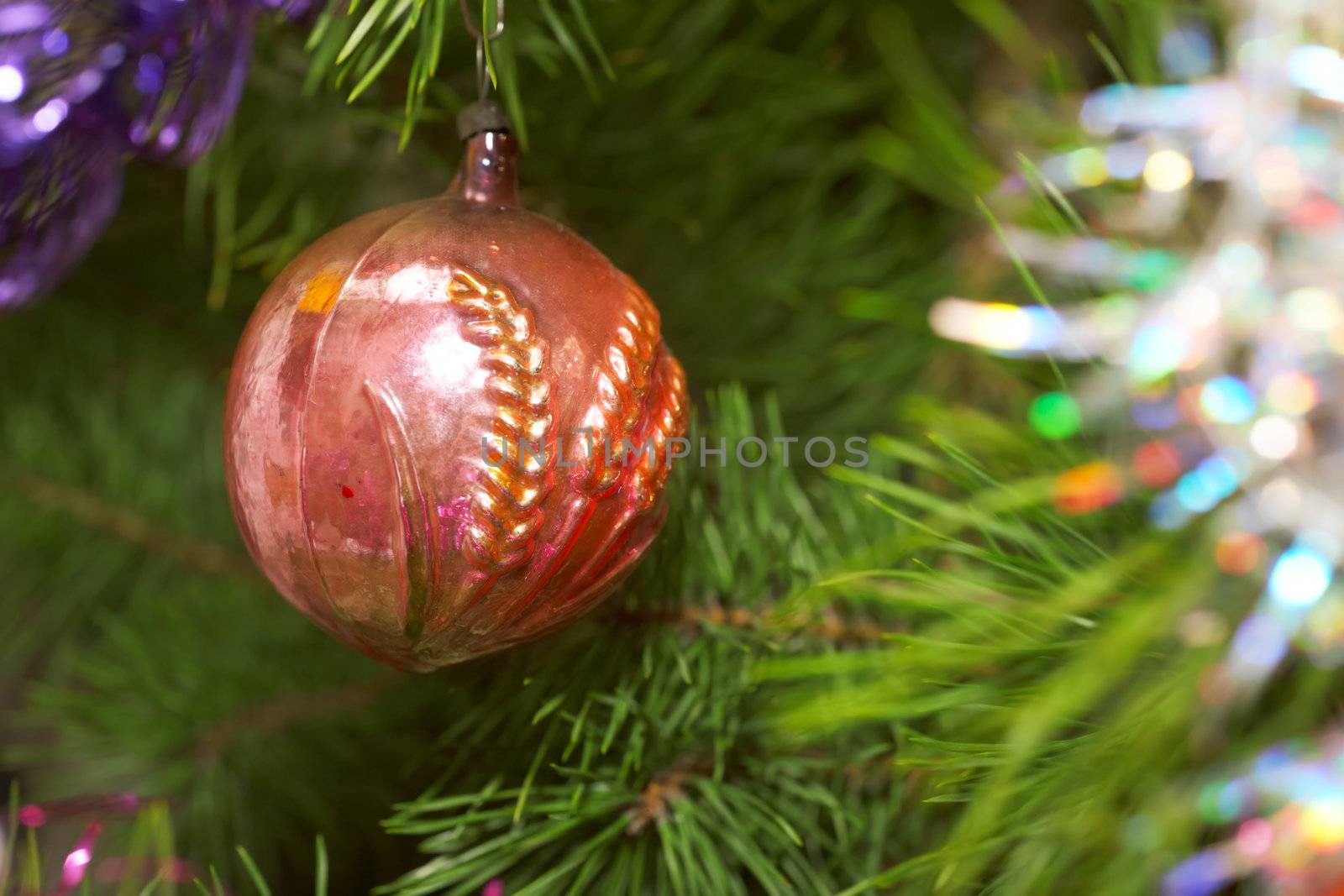 Xmas tree. Red glass sphere.  Sparkling tree ornament 