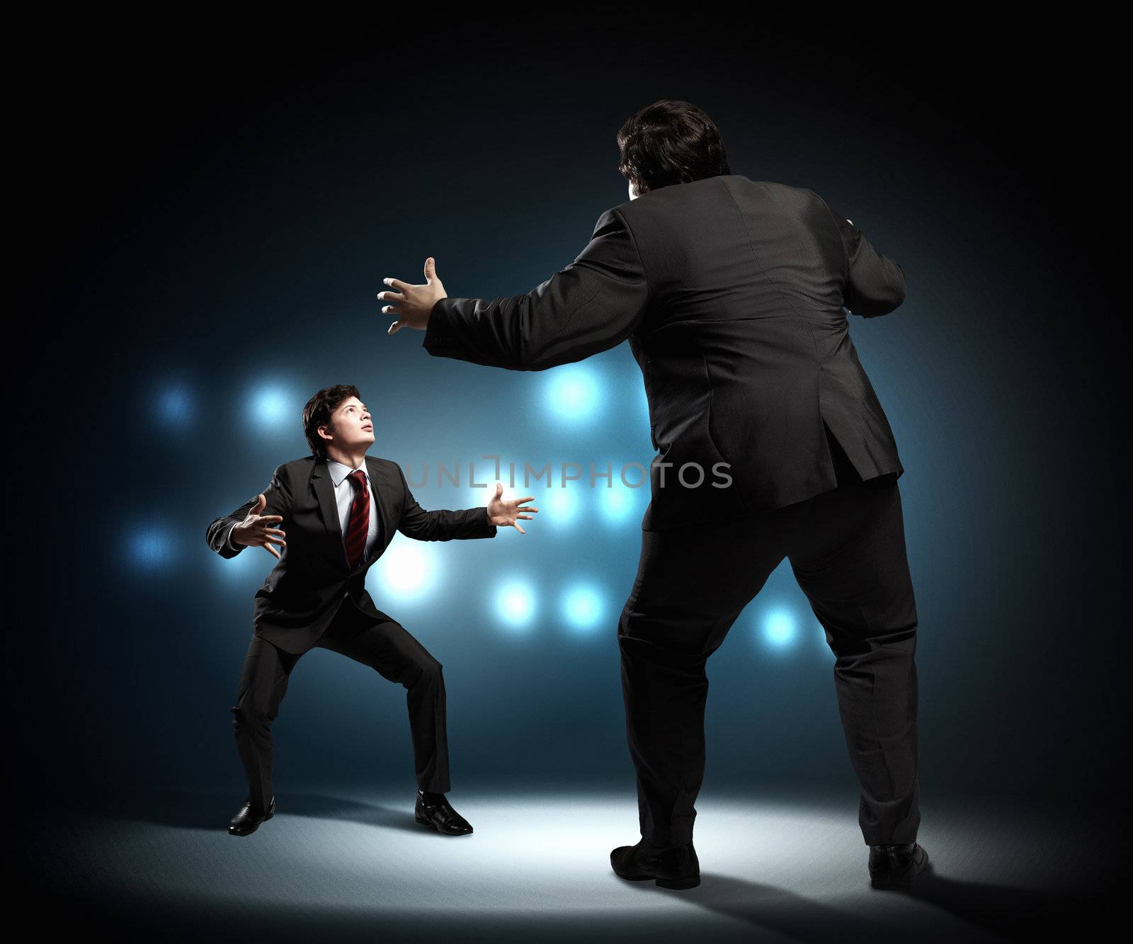 Image of businesspeople arguing and acting as sumo fighters