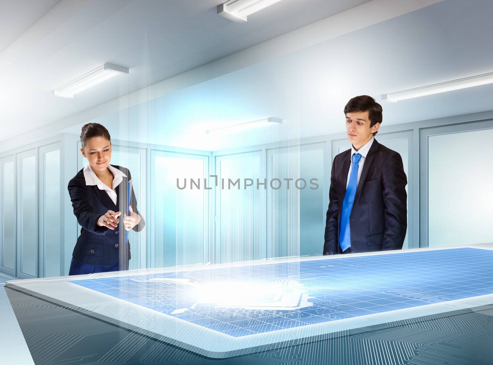 young businesspeople clicking on icon of high-tech image