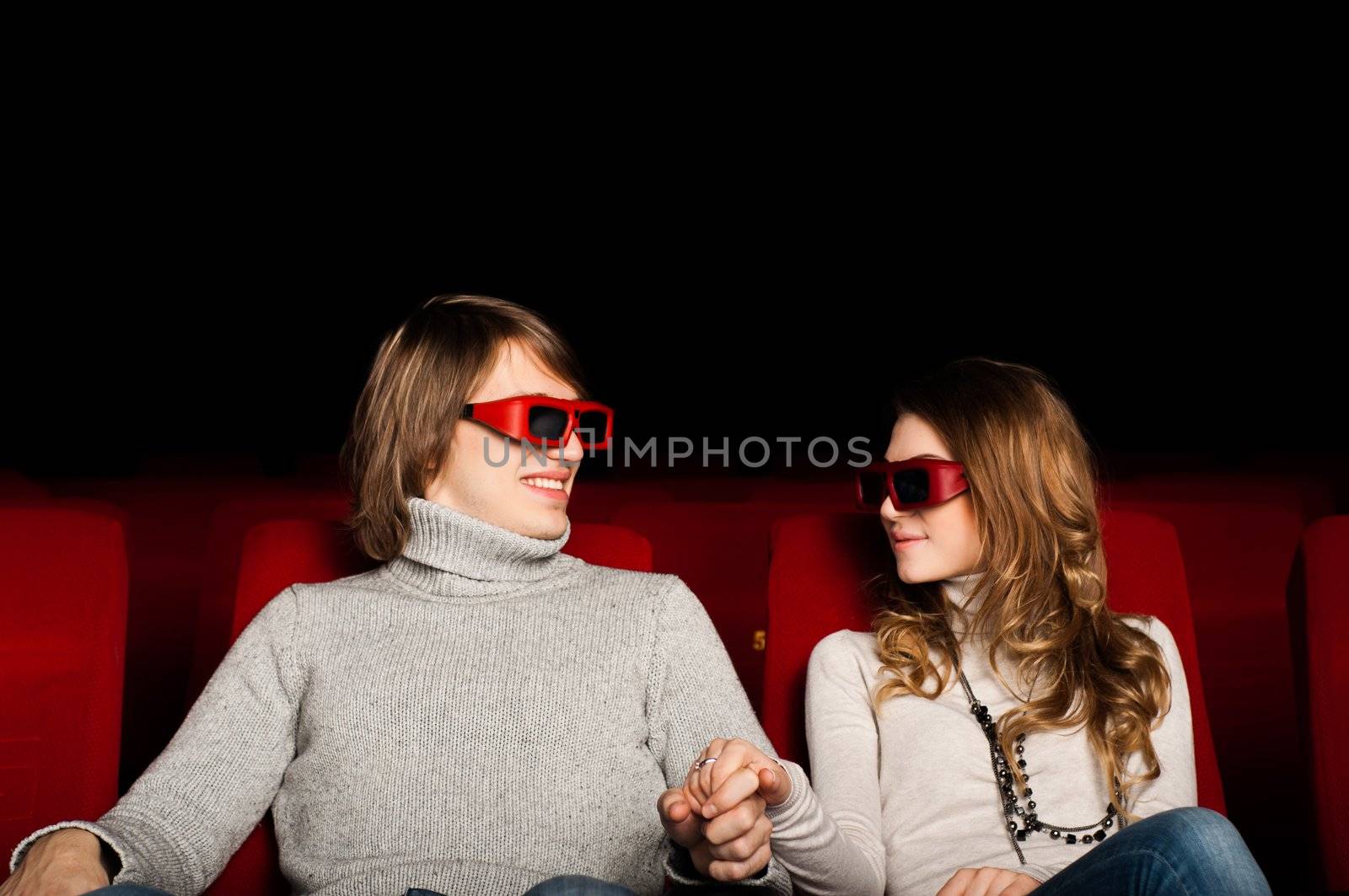 young couple in the cinema to enjoy the movie