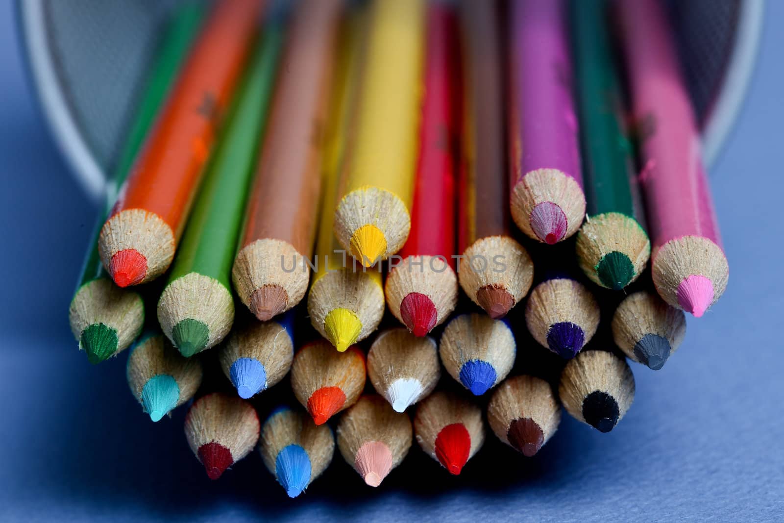 Colored pencils with blue background