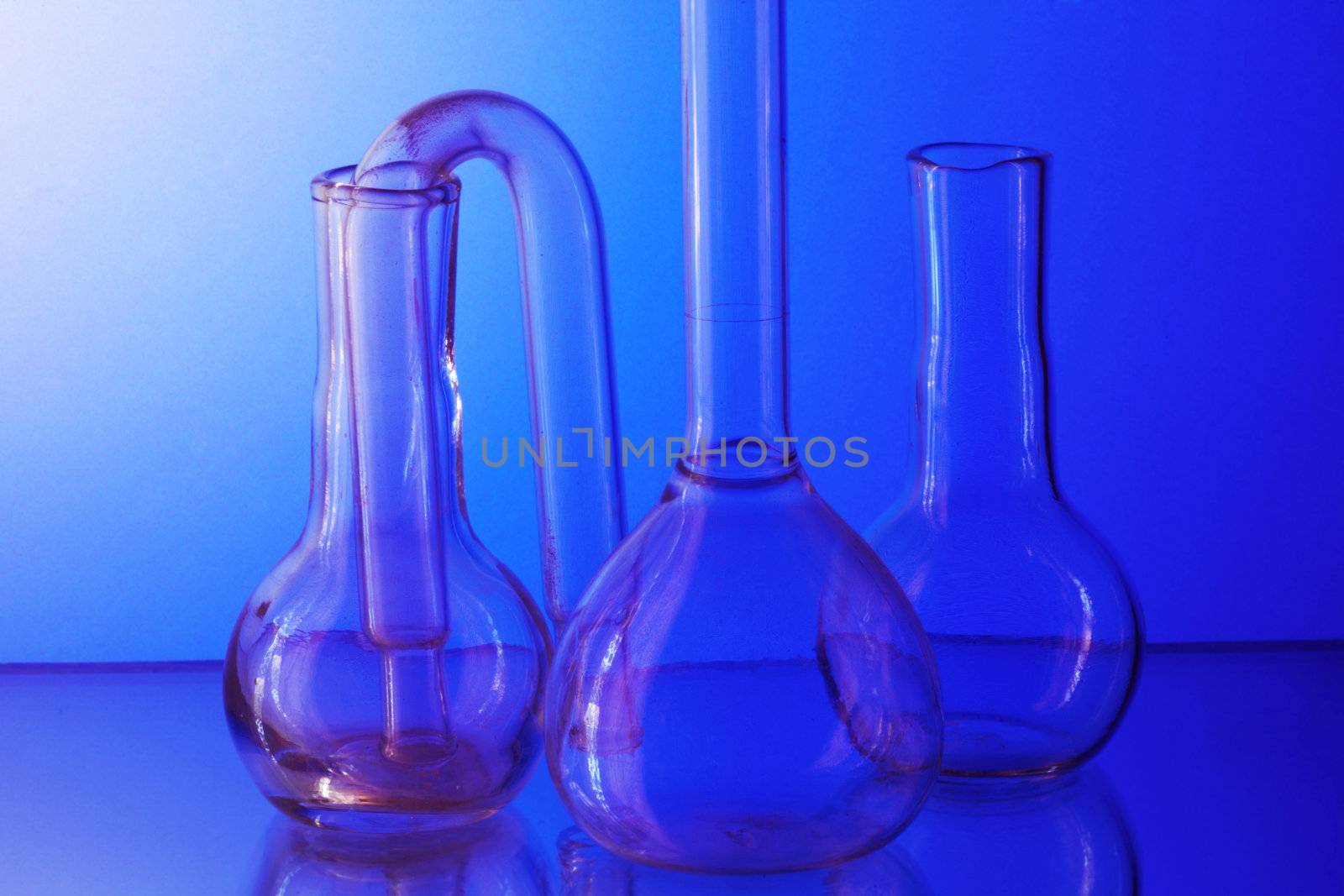 Laboratory glasswares for the analysis on a blue background