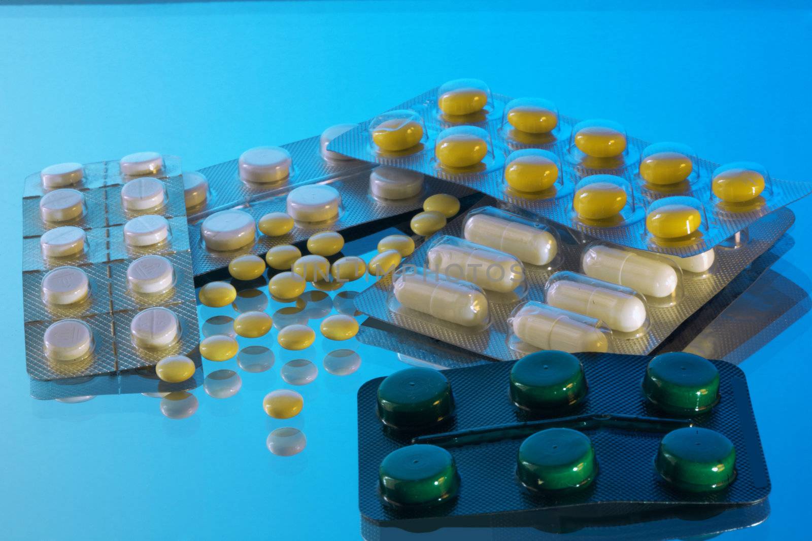 Medicine. Tablets and medicine on a blue background